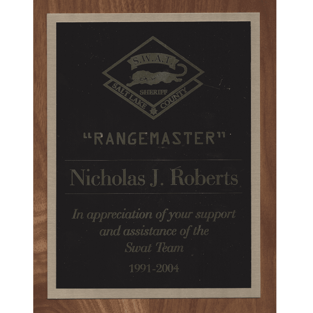 Plaque honoring Nicholas J. Roberts, Rangemaster for Salt Lake County Sheriff SWAT Team, 1991-2004.