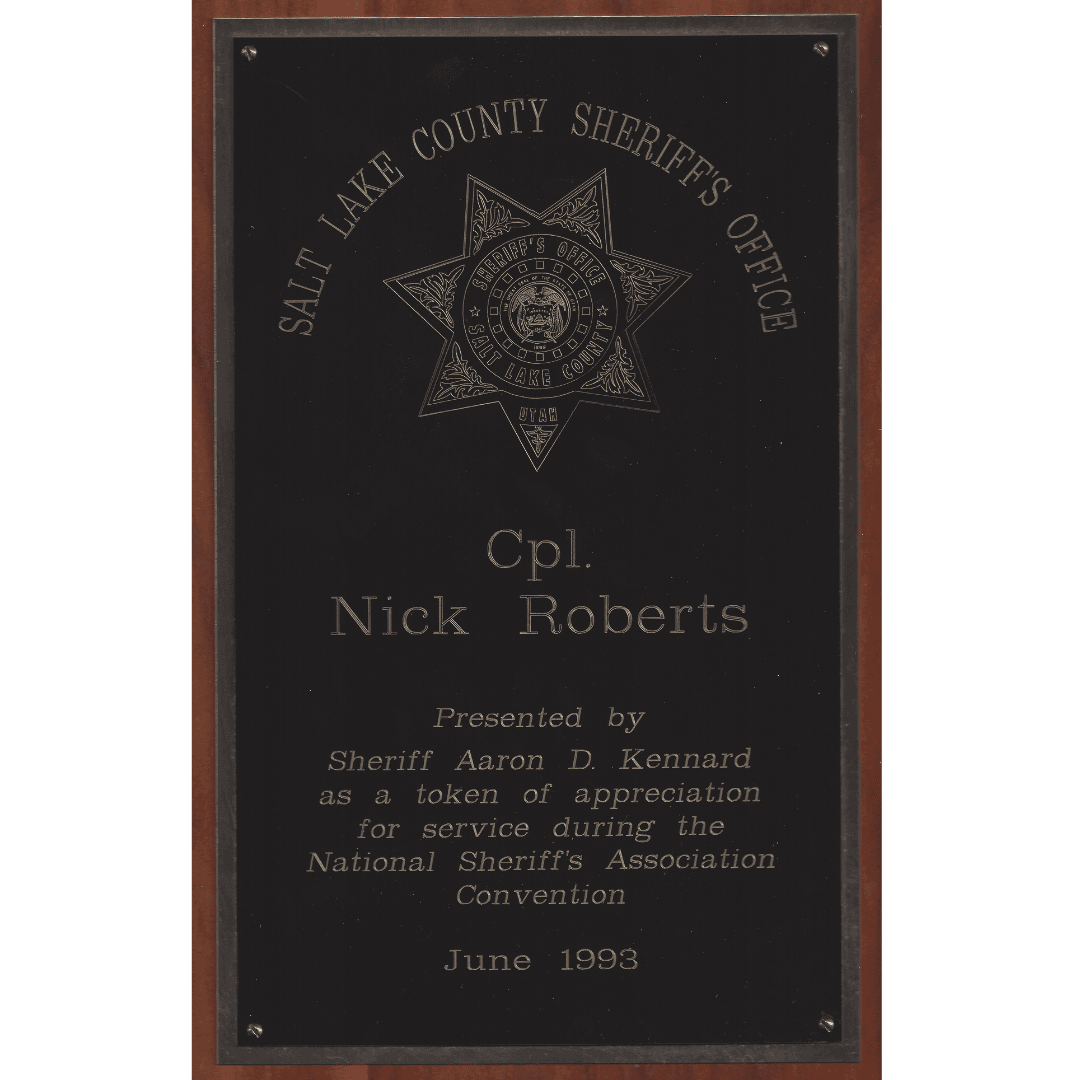 Black engraved plaque honoring Cpl. Nick Roberts from the Salt Lake County Sheriff's Office, 1993.